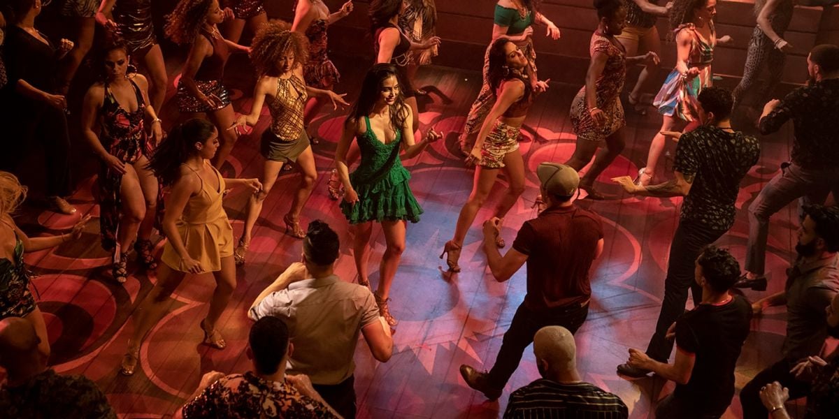 Vanessa tries to entice Usnavi to join her on the dance floor of a nightclub.