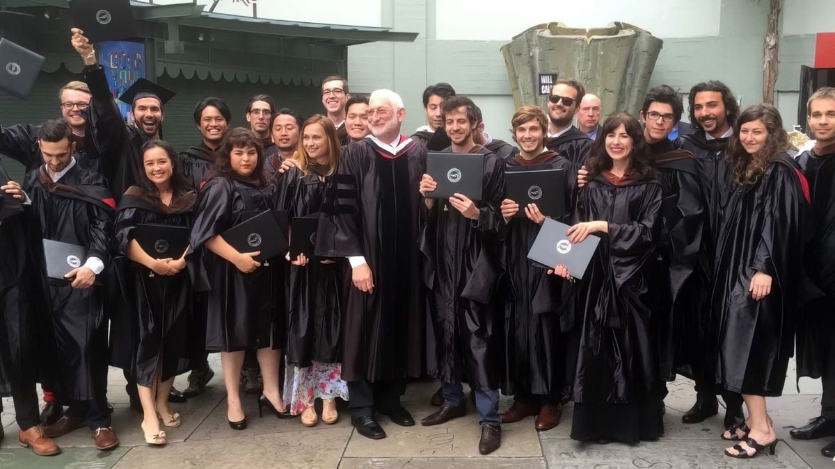 Hutchens stands next to ASC president and AFI dean of cinematography Stephen Lighthill (center) at her 2015 graduation ceremony. (Photo by Matt Hutchins)