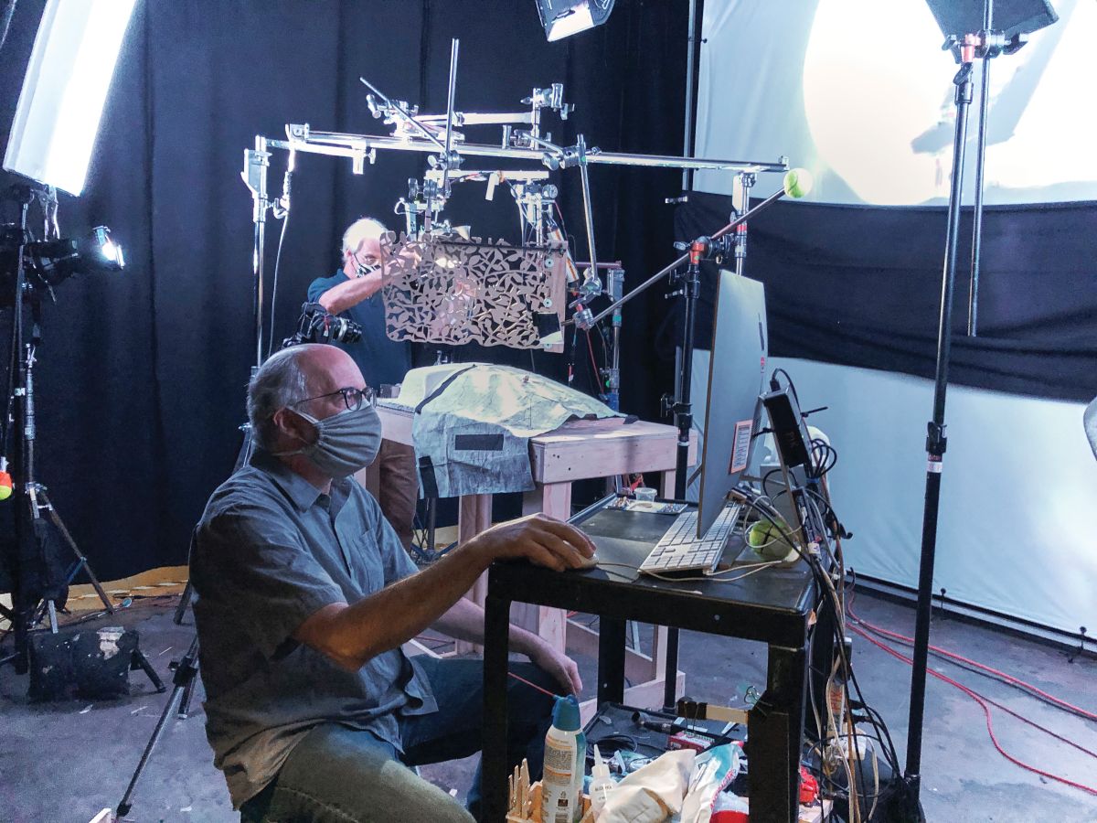 Stop-motion cinematographer Eric Adkins monitors the progress of a shot as stop-motion gaffer Dwight Campbell adjusts a setup. (Photo by Drex Reed)