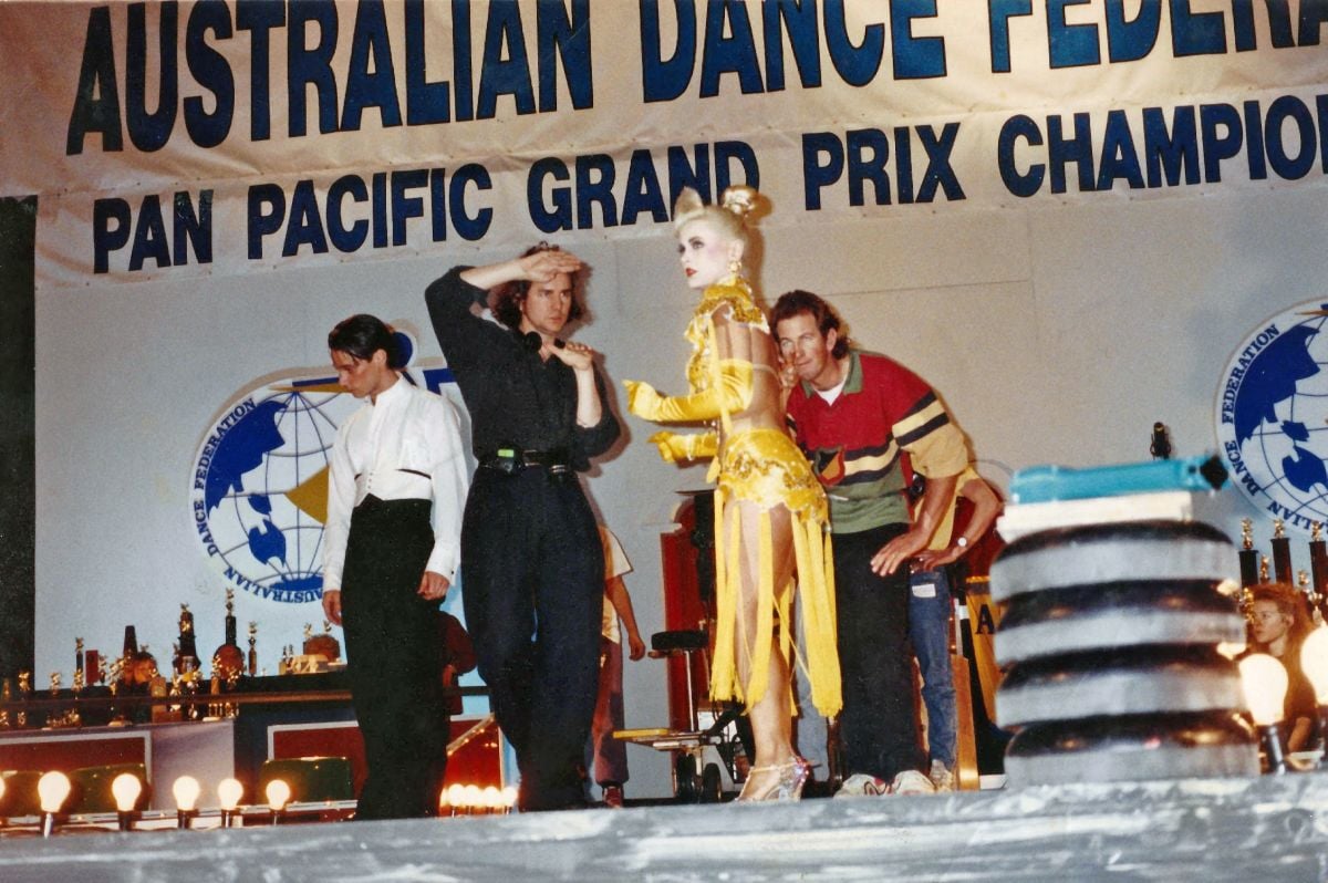 Luhrmann and Mason (center, from left) plot coverage with Mercurio (far left) actress Gia Carides on one of their dance hall locations. (Photo courtesy of the cinematographer.)