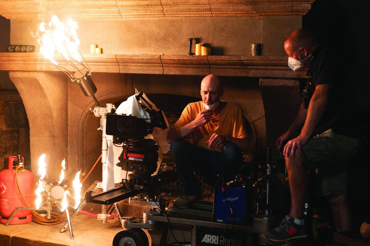 Operator Joe Russell and crew work on a scene that employs genuine firelight as an offscreen source.