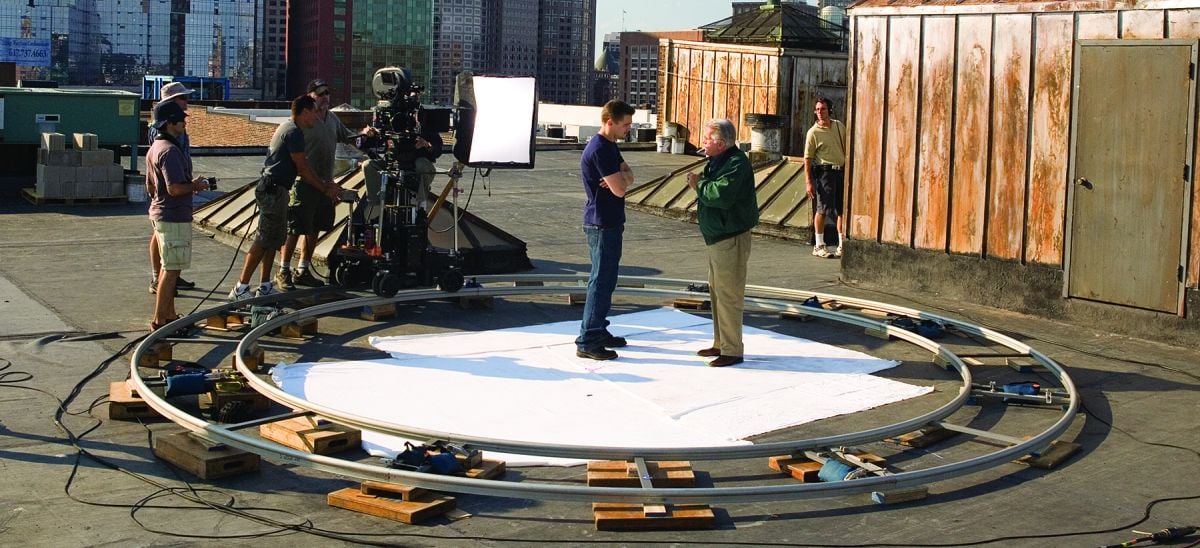 Leonardo DiCaprio and Martin Sheen have a secret rooftop meeting in The Departed (2006). This shot was ultimately cut to save screen time, which led Ballhaus to lament, “When you’ve done some nice moves and they don’t make the cut, you feel a little bit sad!”