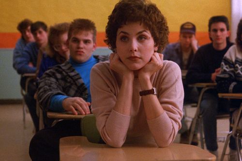 Audrey Horne (Sherilyn Fenn), one of Laura’s classmates, awaits some news.