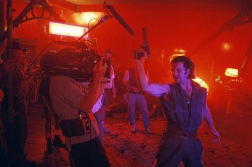 A-camera operator David Crone captures a shot of an attacker for a vibrantly colored flashback to the murders. Visible at far left is Wolski’s gaffer, future ASC cinematographer Claudio Miranda.