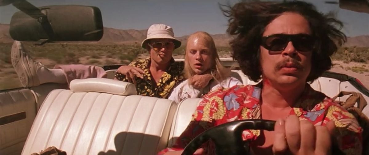 Duke and the hitchhiker (Tobey Maguire) ride in the back as Gonzo takes the wheel.