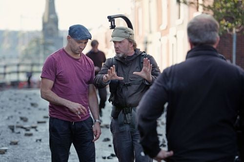 Director Yann Demange (left) and cinematographer Tat Radcliffe confer on set. The production used four cities in northern England to recreate period Belfast locations.