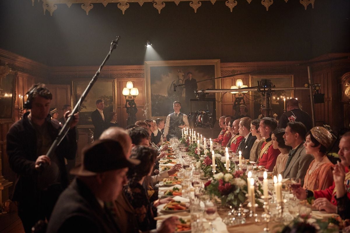 Cast and crew ready a lavish dinner scene.