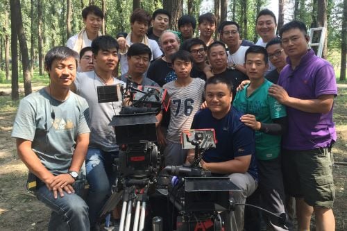 Chris Chomyn, ASC, poses with crew on location in China for <em>The Three-Body Problem</em>.