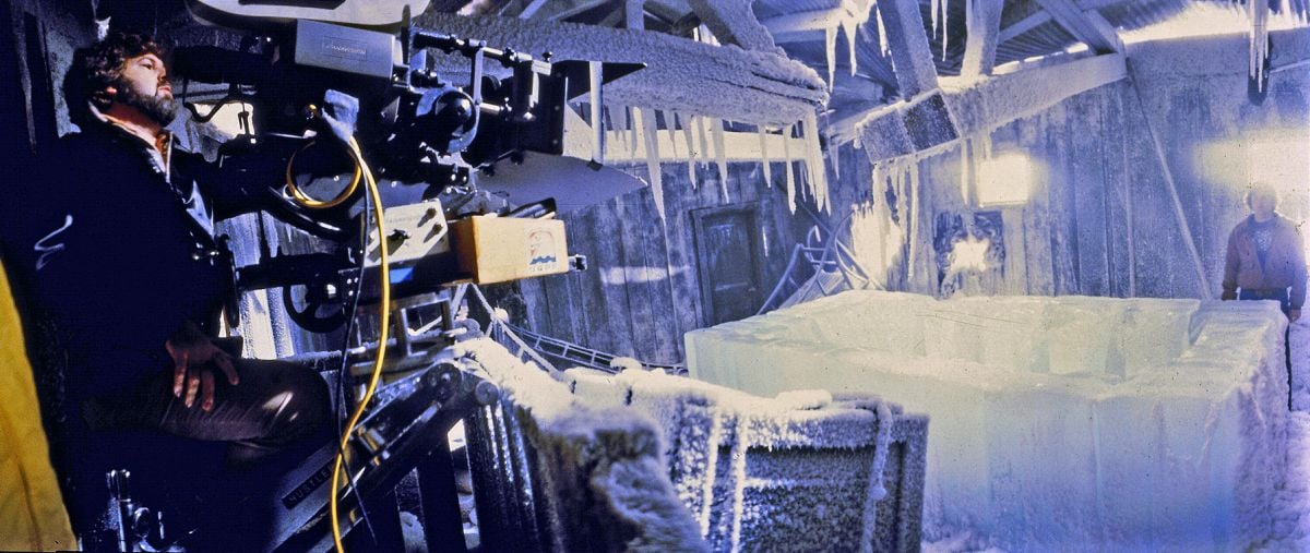 On stage at Universal Studios, Dean Cundey sets a shot with the help of a stand-in during the production of The Thing. (Photo from the collections of the Margaret Herrick Library.)