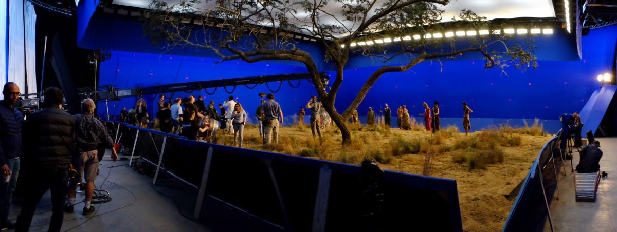 Working on a stage in Atlanta, the cast and crew ready a bluescreen-surrounded African "exterior."