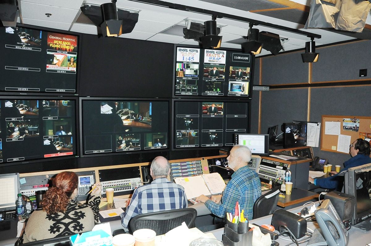 From left: Associate director Teresa Cicala, director William Ludel, technical director Chuck Abate and lighting director Bob Bessoir work at a fast pace inside the production control booth.
