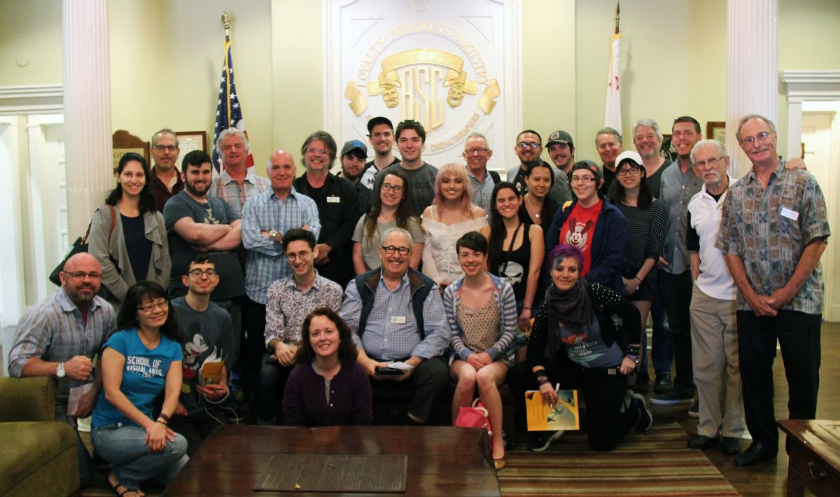 Former committee chair George Spiro Dibie, ASC (center, seated) with a visiting student discussion group at the ASC Clubhouse.