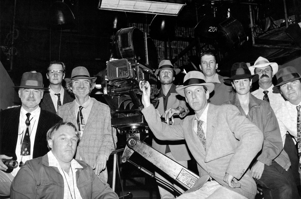 In this fun behind-the-scenes portrait by unit photographer Merrick Morton, the crew of L.A. Confidential really gets into the film noir mood. Featured are Spinotti and Hanson (both wearing fedoras, left of the camera).