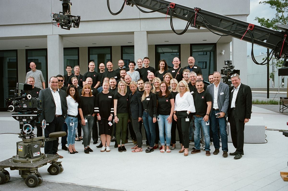 Leica executives and employees assemble in front of the Ernst Leitz Wetzlar building. (Photo by James Hills)