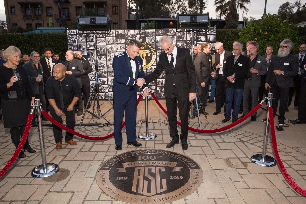 ...a massive circular bronze plaque installed in the cobblestone square, designed from the ASC’s 100th Anniversary logo.