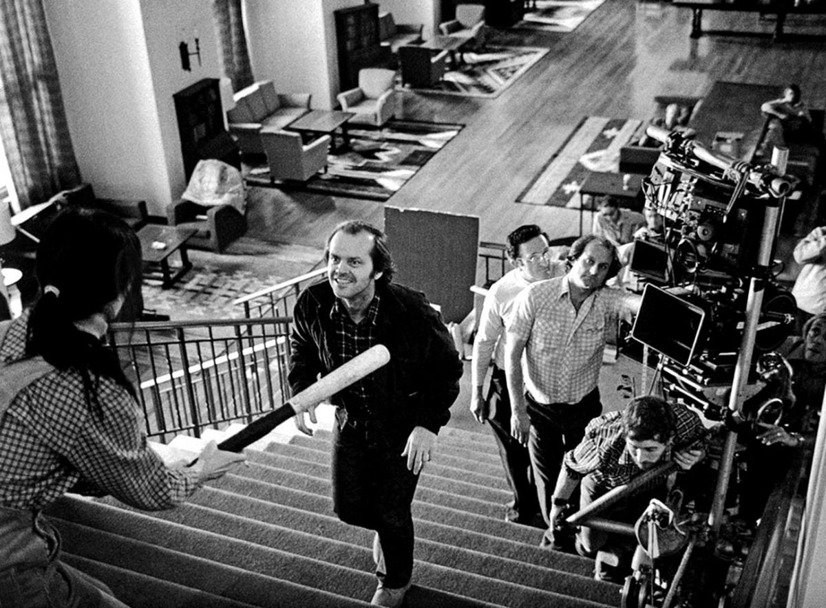 Jack (Jack Nicholson) advances on Wendy (Shelly Duvall) as the cameras trail up the staircase on a custom, multi-camera rig. Note that the shot on Duvall seen in the film’s final edit appear to have been photographed with the Steadicam, as there is a sense of greater movement and the perspective is from the center of the staircase, not the side.