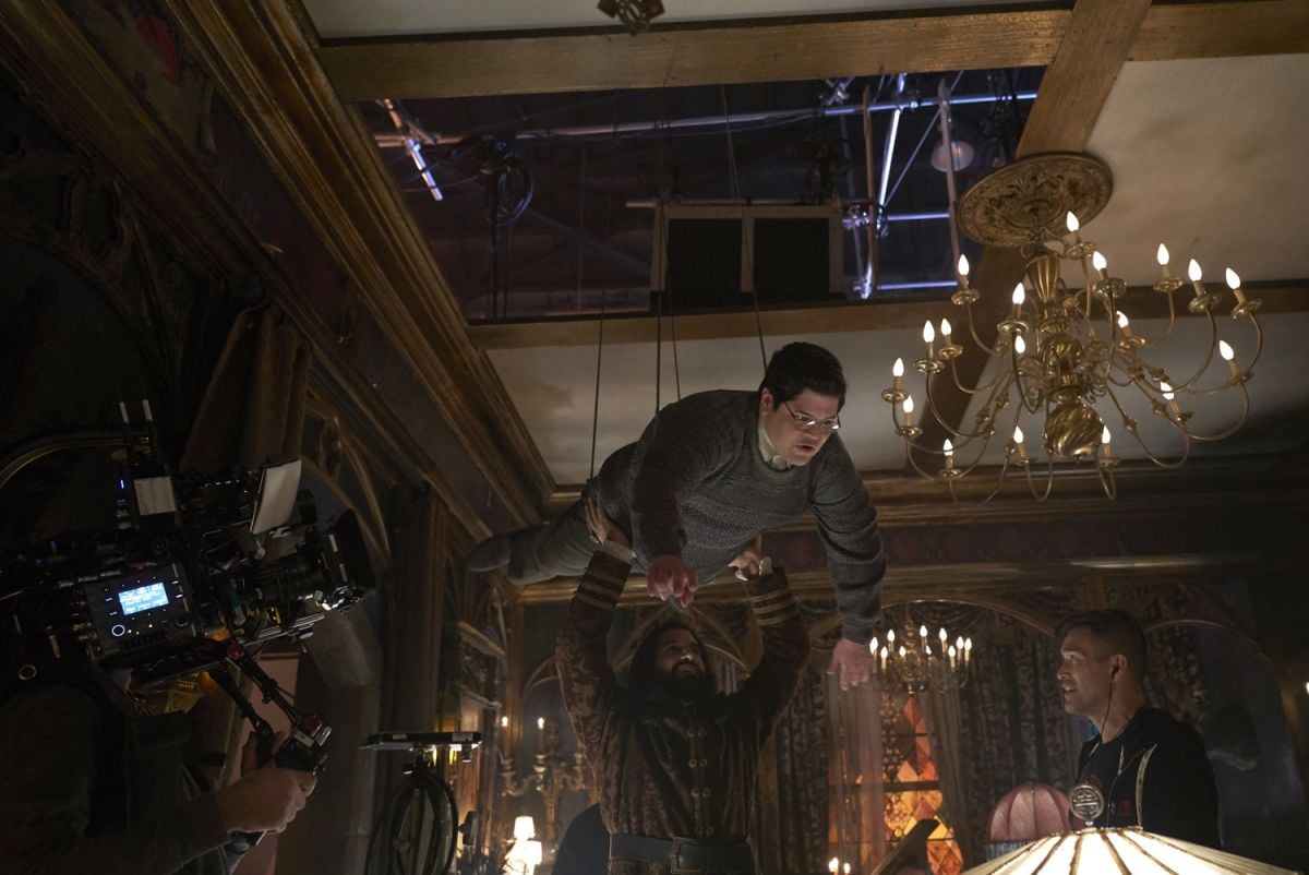 A handheld Sony Venice captures a shot of Guillén suspended on wires. “We needed ceilings throughout our sets so we wouldn’t have any ‘shoot-off’ issues that might restrict the actors’ movements during a scene, but all of the ceilings had to be removable for wirework,” Stipsen says. The ceiling pieces, he adds, “were stretched unbleached muslin — which the painters had aged — over a wooden frame.”