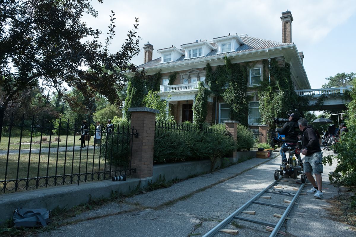 Cast and crew capture a scene outside of Winnipeg's historic Gordon House.