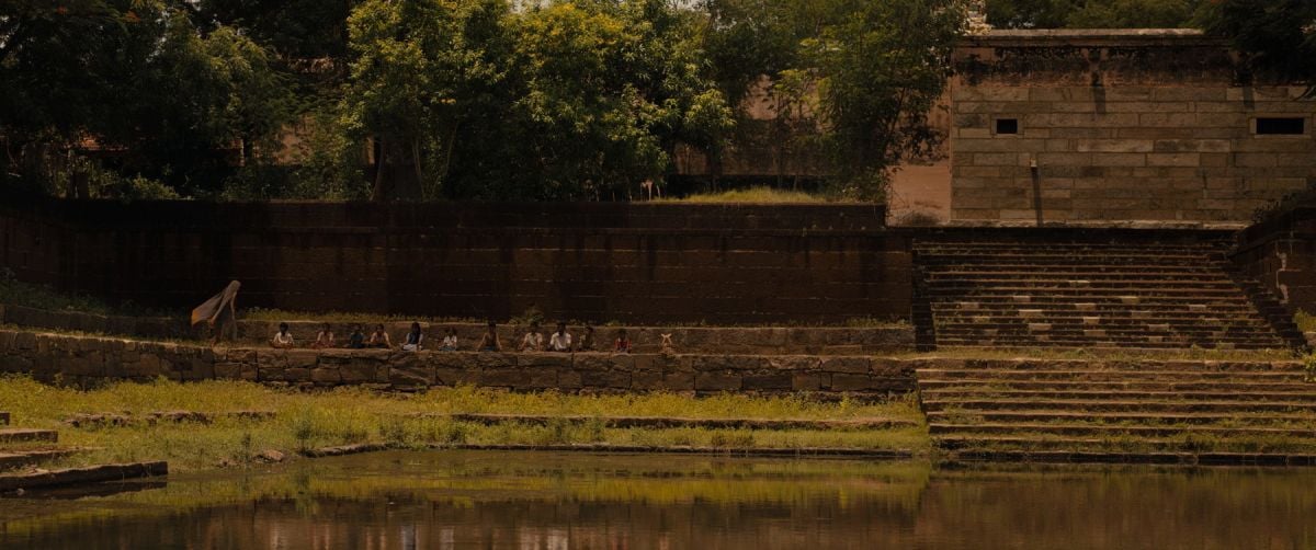 The movie begins at a temple in India, where Isabel guides a meditation with the children of the orphanage.