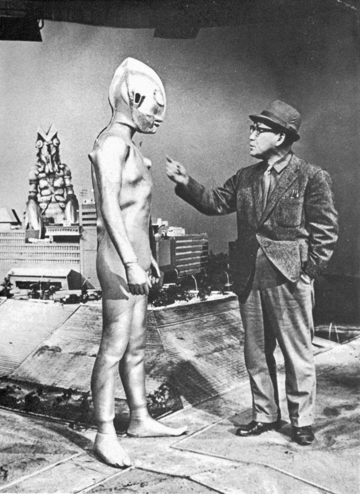 Eiji Tsuburaya and his screen hero Ultraman on a miniature-landscape stage.