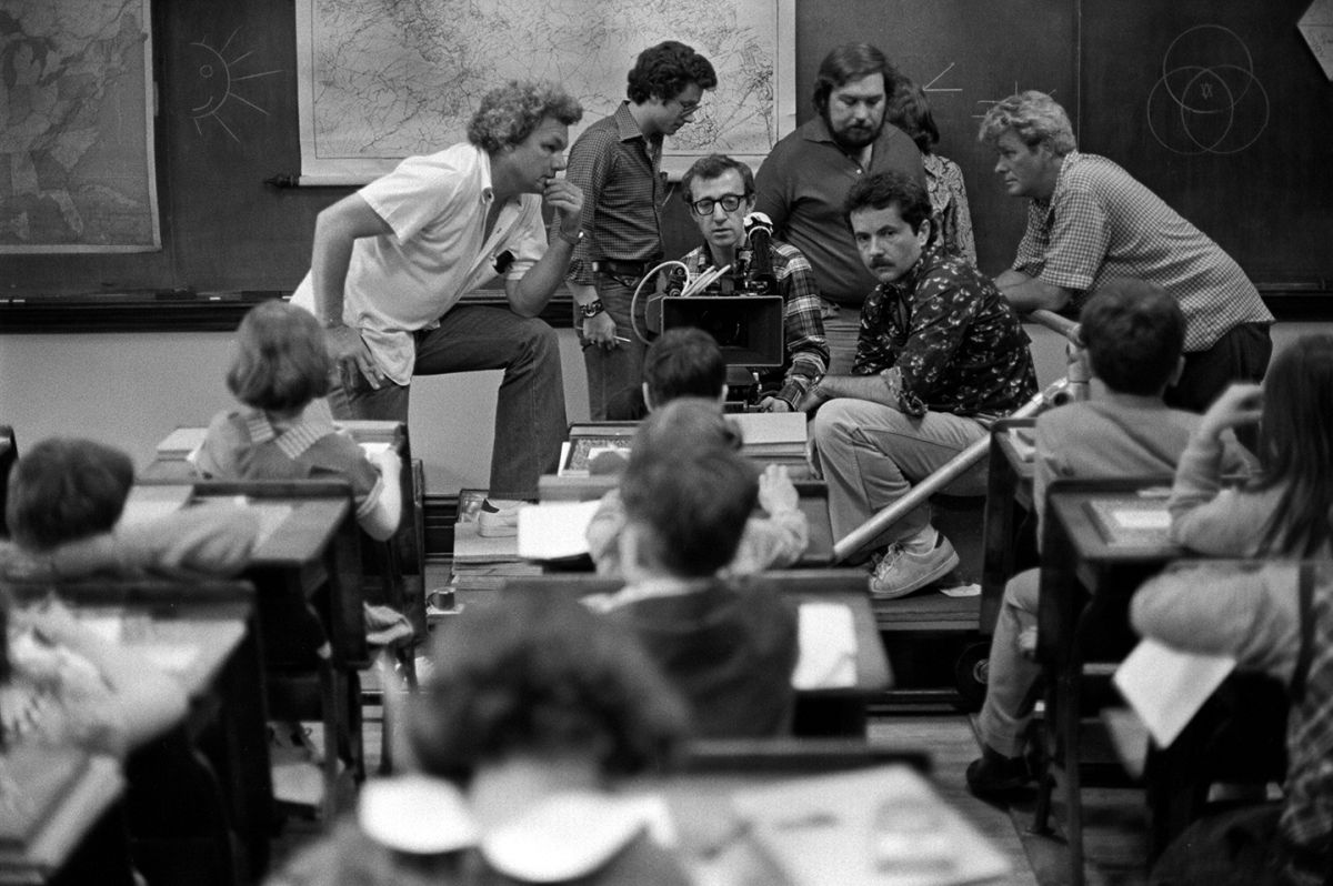 Willis, director Woody Allen and crewmembers frame a shot for the flashback to Alvy Singer’s grade-school days in Annie Hall. Despite these scenes' hilarious tone, they are handsomely photographed and lit in a style that might be equally appropriate for a “serious” film. “For the retrospective scenes in Annie Hall, I used a warmer kind of look,” Willis explained. “I collaborated closely with the production designer, Mel Bourne, and all of the colors we used for the sets were picked very carefully to create the feeling of that period.”