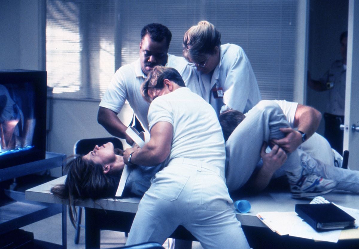 Sarah Conner (Linda Hamilton) resists orderlies the Pescadero State Hospital.