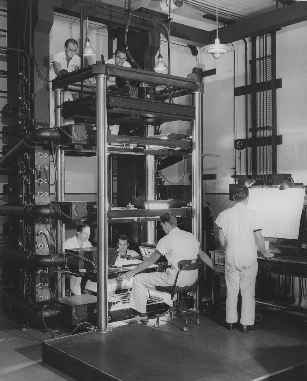 The special Multiplane camera. Here it is photographing a background (bottom), one plane of animation (middle) and a foreground plane (directly below camera stage).