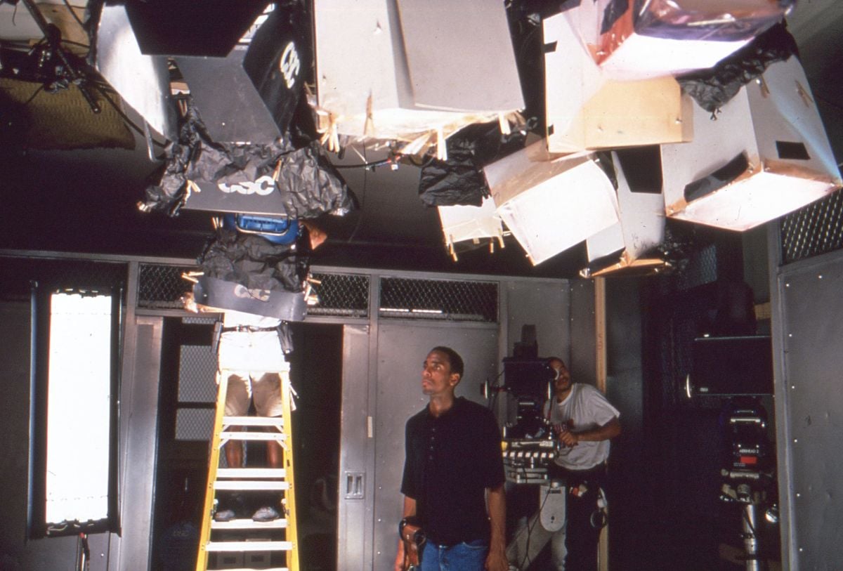 For an interrogation scene involving a young boy (Pee Wee Love) and his mother Iris Jeeter (Regina Taylor), Sayeed sought inspiration from Robert Richardson's approach to similar scenes in the Oliver Stone film JFK. A combination of ceiling-mounted HMIs and floor-mounted Kinoflos, in conjunction with Kodak's unusual 5239 film stock and a reflective board on the table, helped to create a hot, glowing aura around the actors. (Seen below.)