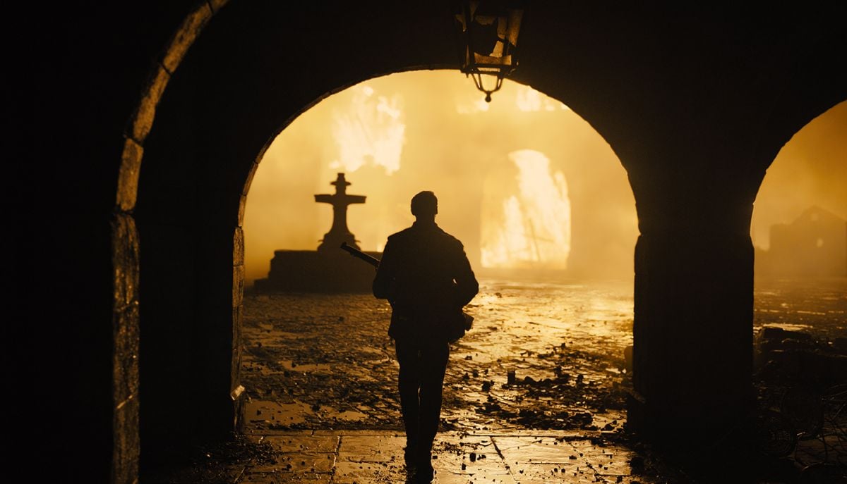 A burning church illuminates the remains of a French village.