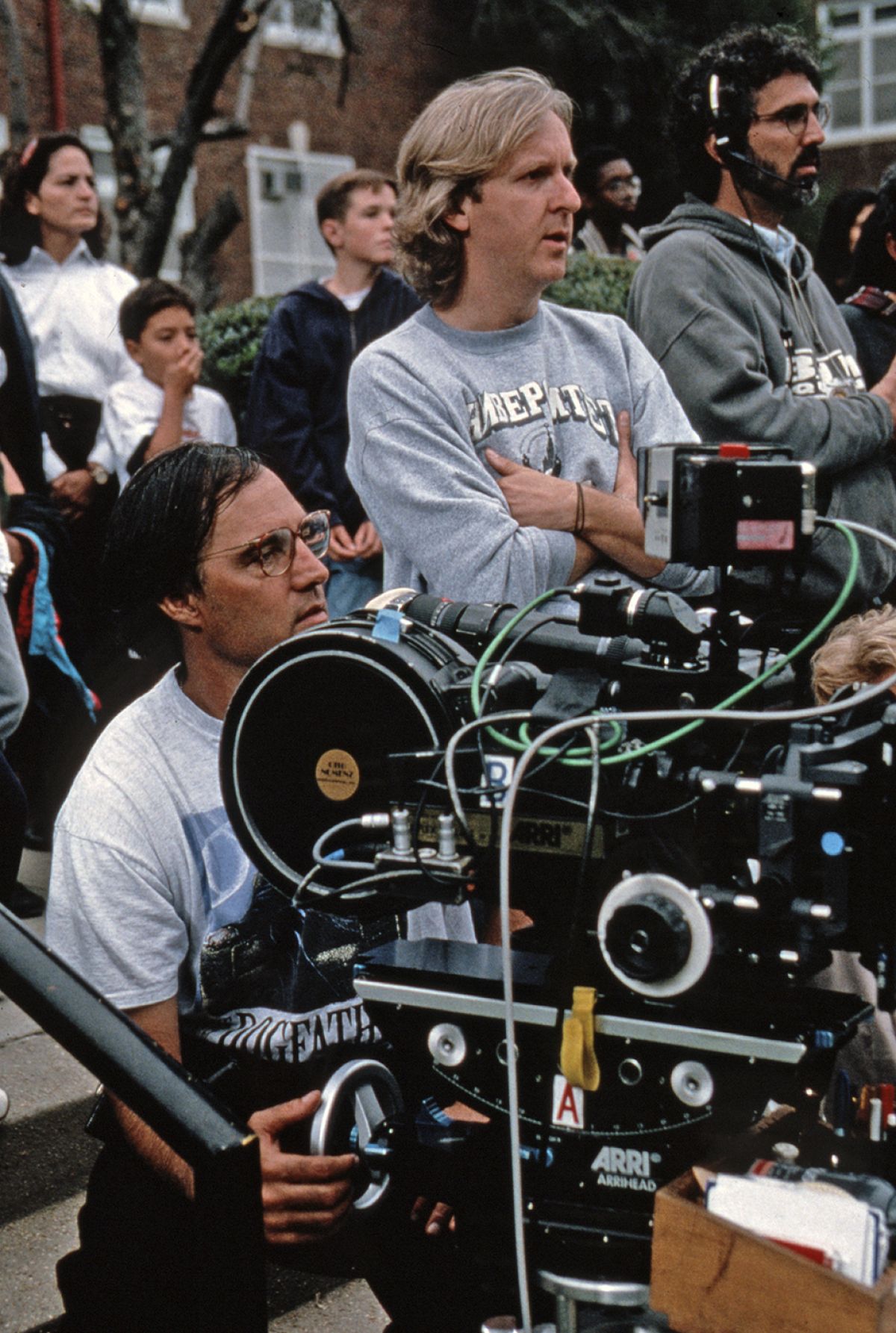 Cinematographer Russell Carpenter (left) and director James Cameron (center) work out a shot on location.