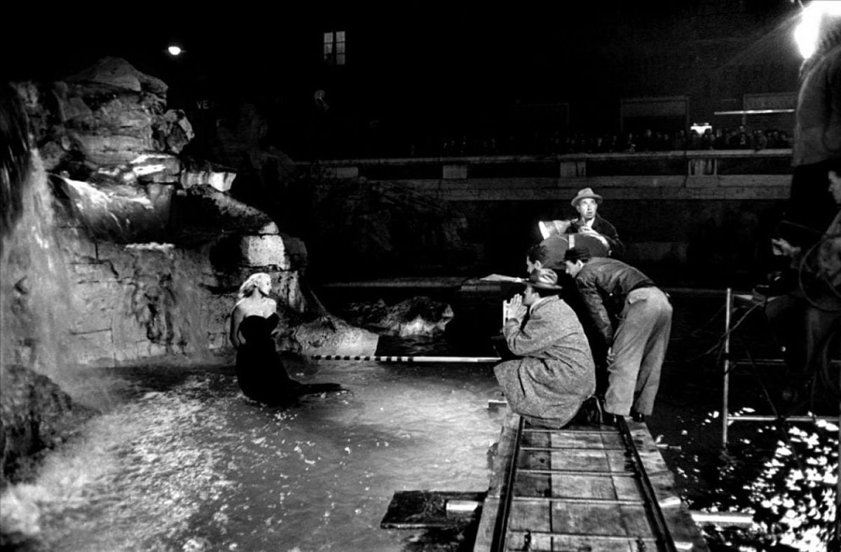Director Federico Fellini and his crew, including cinematographer Otello Martelli, shooting the famed sequence at the Trevi Fountain in Rome