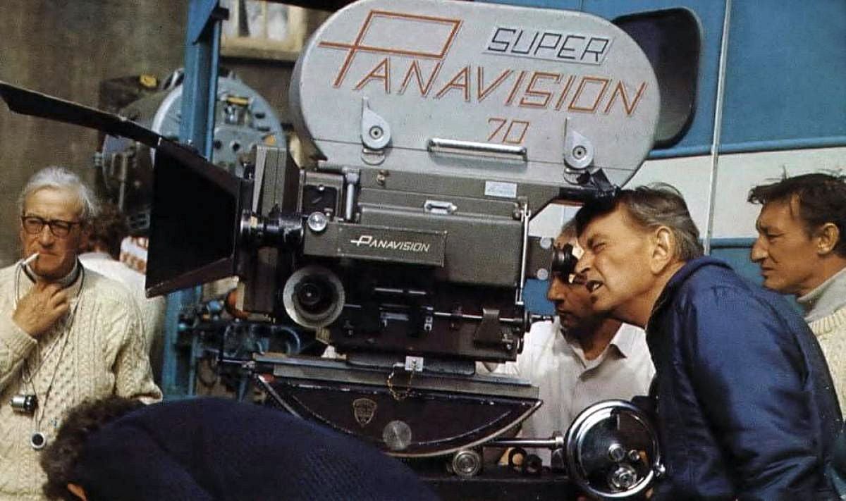 Lean checks camera angle through the viewfinder while Young (left) scans the scene. Shooting in 65mm Super Panavision 70 called for the cinematographer to light to deep stops in order to maintain any workable depth of field.
