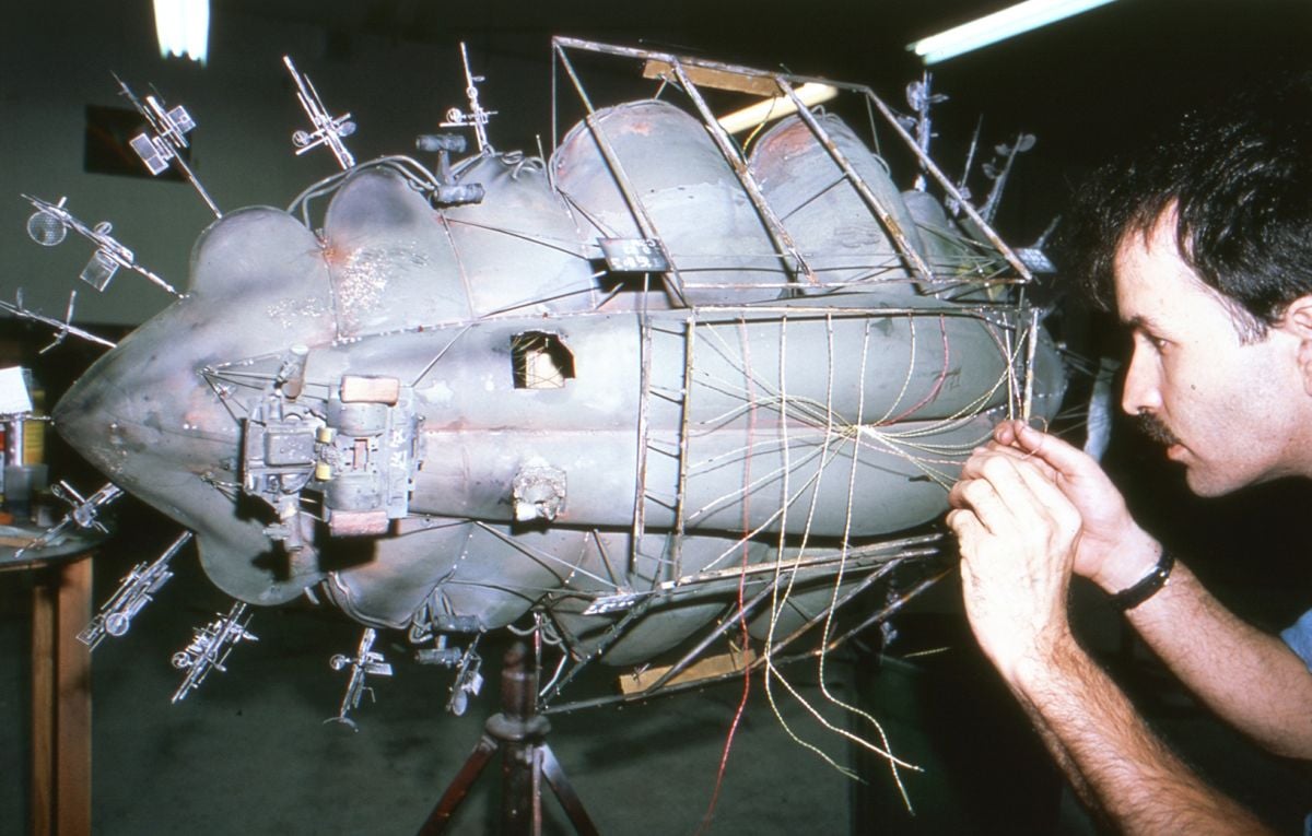 Michael McMillen works on the Blimp model, which is only briefly glimpsed in the film.
