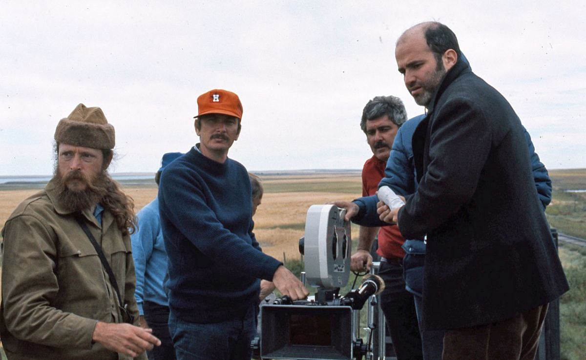 Camera operator John Bailey (second from left) and the rest of the camera crew set up a shot under the watchful eye of writer-director Terrence Malick (far right).